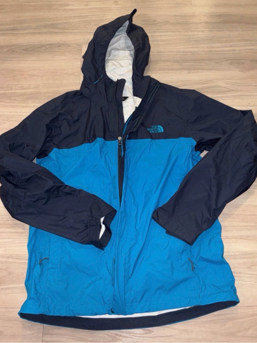 The North Face Men’s Blue and Black packable Hood Rain Jacket